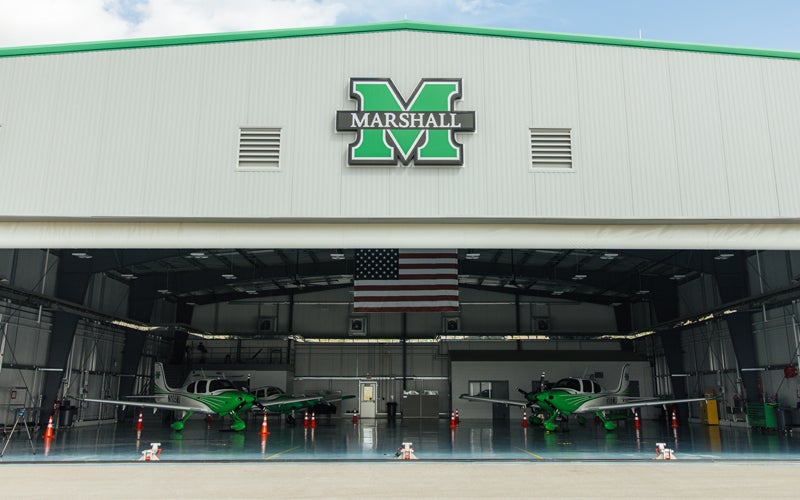 Two Marshall branded planes sit in the hanger at Marshall University's Bill Noe Flight School