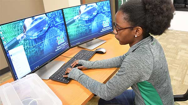 Cyber Forensics & Security student working in dedicated computer lab