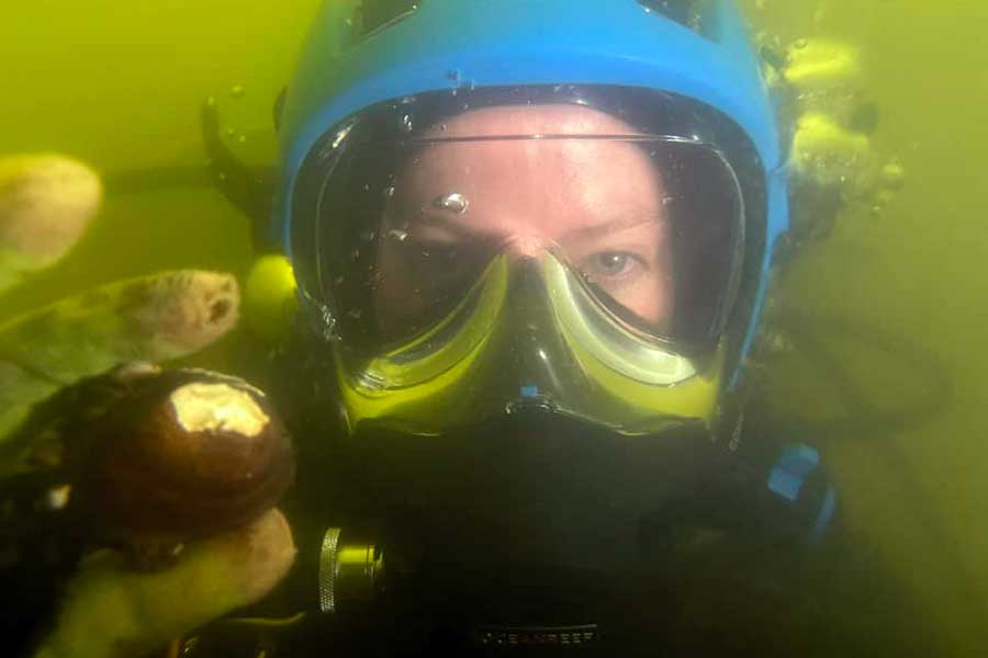 NRES student diving for mussels