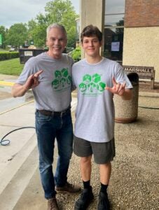 Marshall University President Brad D. Smith with Christian Perez