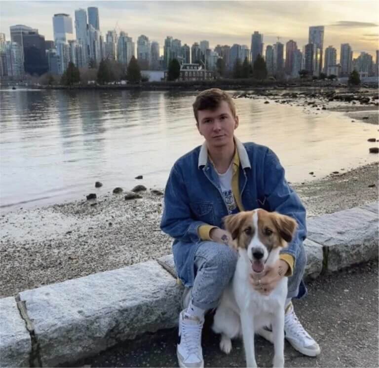 photo of Dustin Ferrell and a dog and a city skyline