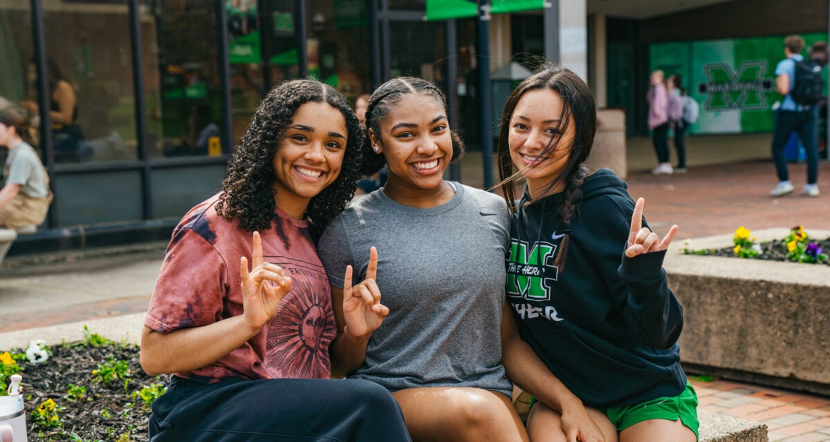 Three students on the Memorial Student Center Plaza at Marshall University