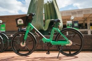 rolling thunder e-bike by the Memorial Fountain on campus